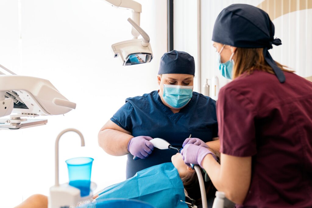 dental clinic workers with young patient