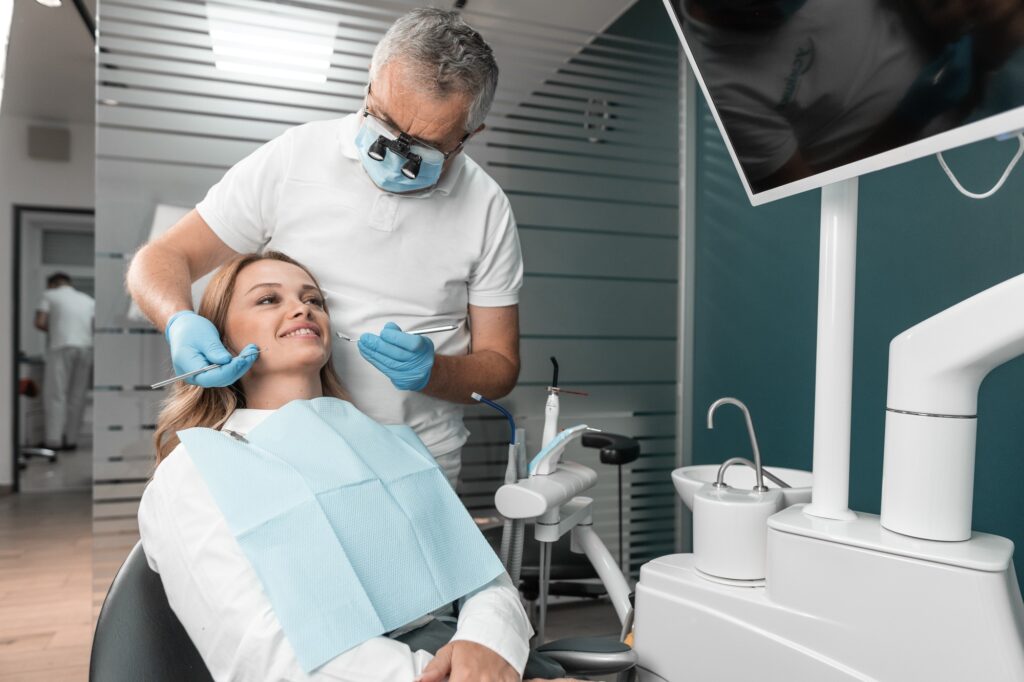 in the dental clinic dental implants are installed to restore the patient s smile the dentist