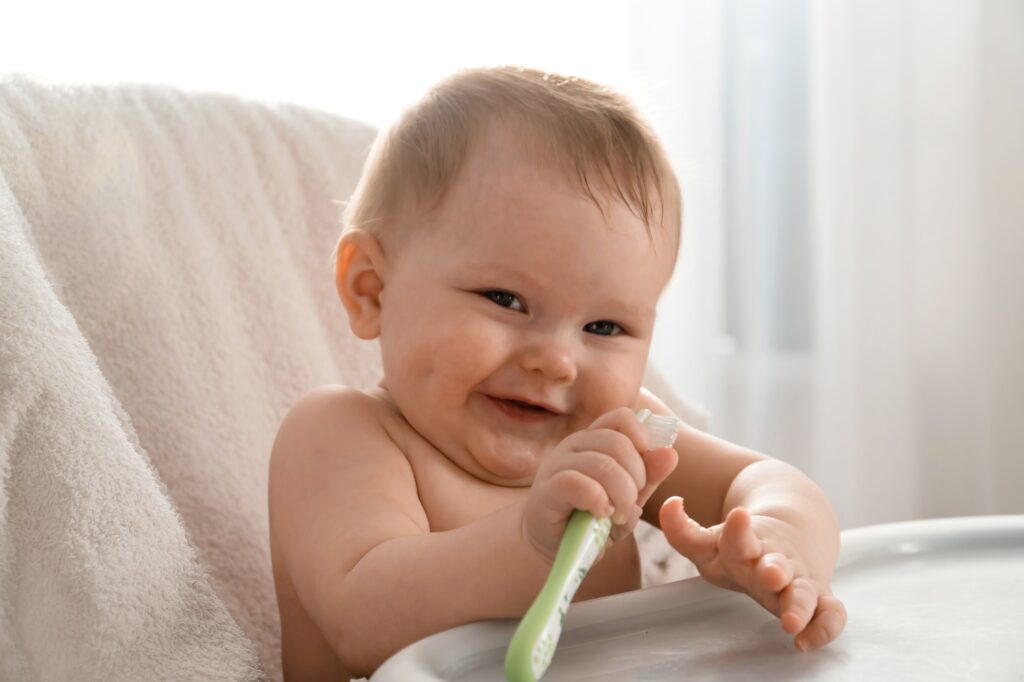 cute infant baby clean teeth