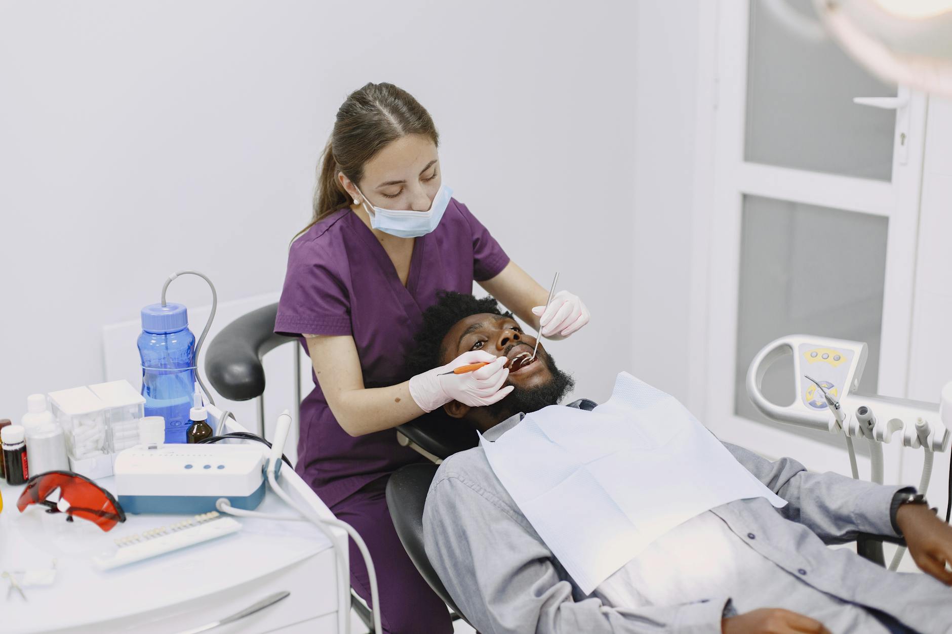dental hygienist cleaning teeth preventive care