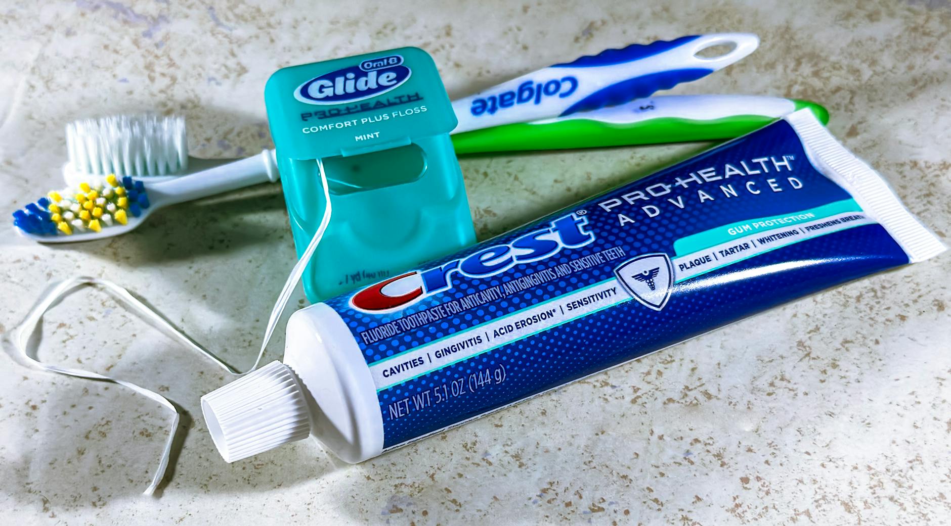 various teeth whitening products arranged on bathroom counter